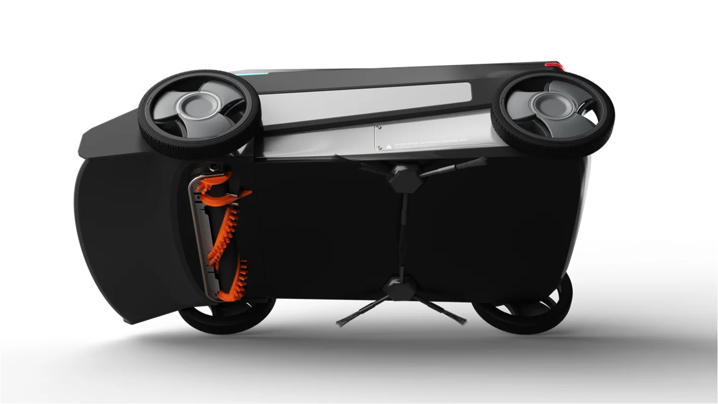 Underbody: toothed intake conveyor, cleaning roller, and twin side brushes